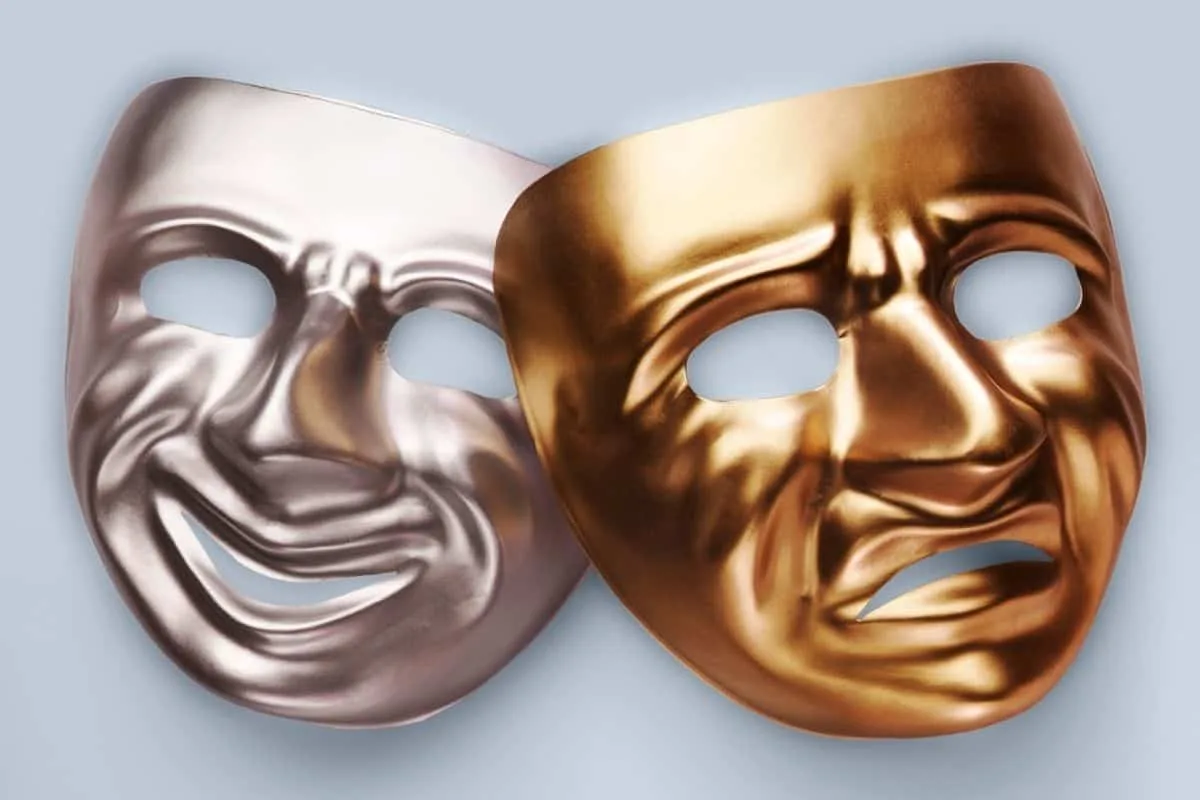 Shiny silver and gold masks with expressive facial designs for parties and costumes.