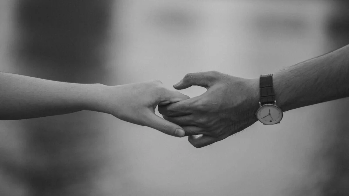 Hands, holding hands, close-up, affection, connection, love, support, intimacy, relationship, tenderness, trust, emotional bond, caring, partnership, human connection.