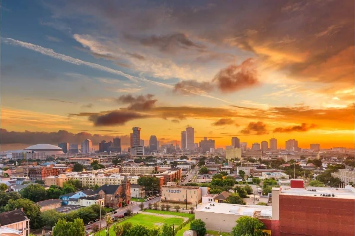 Panoramic view of the New Orleans skyline at sunset displaying the iconic urban cityscape and architecture often featured in popular movies set in New Orleans